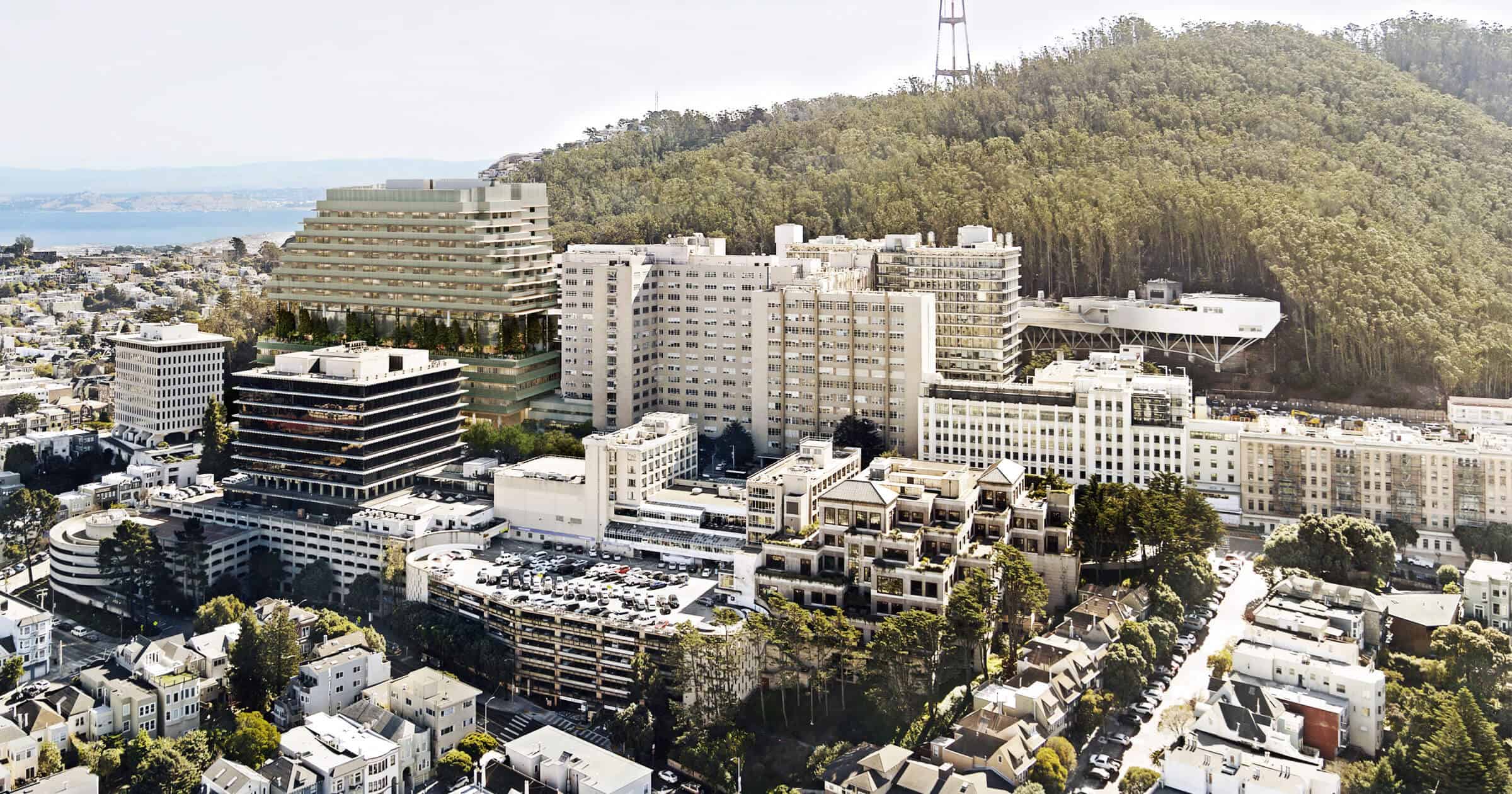 aerial view of city and surrounding valley near hospital site